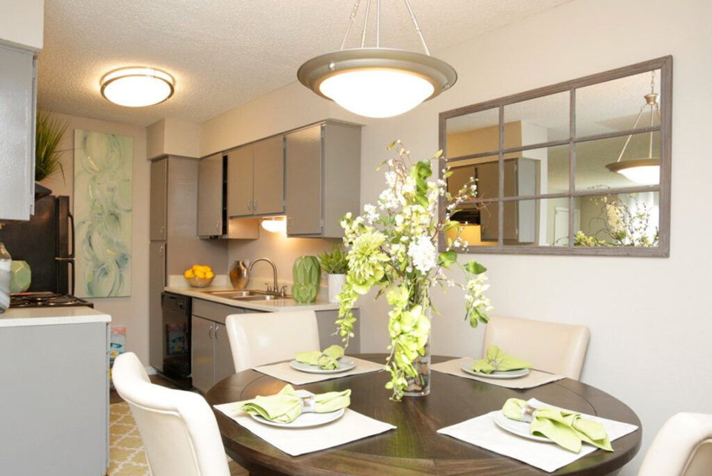 Set dining table and kitchen interior of Pindo Pointe apartment